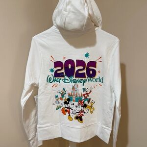 BRAND NEW 2026 DISNEY WORLD
PARKS ZIP UP HOODIE JACKET IN WHITE SIZE XS